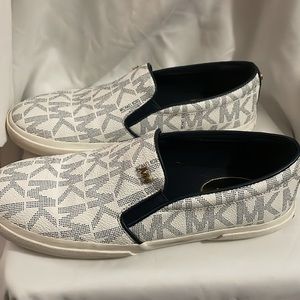 Women’s Michael Kors white slip on sneakers